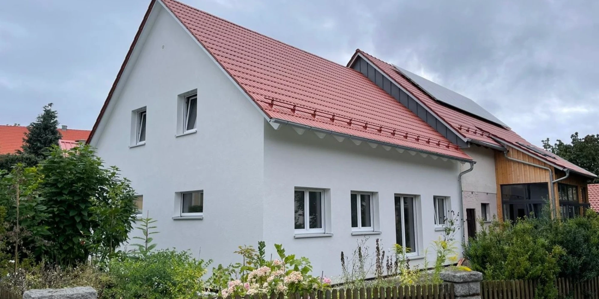 Erfolgreicher Bau auch in der Krise: Familie Müller freut sich über ihr neues Einfamilienhaus