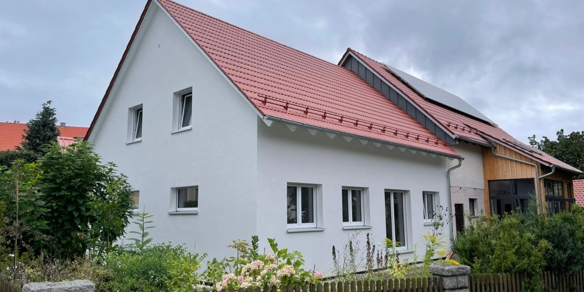 Erfolgreicher Bau auch in der Krise: Familie Müller freut sich über ihr neues Einfamilienhaus