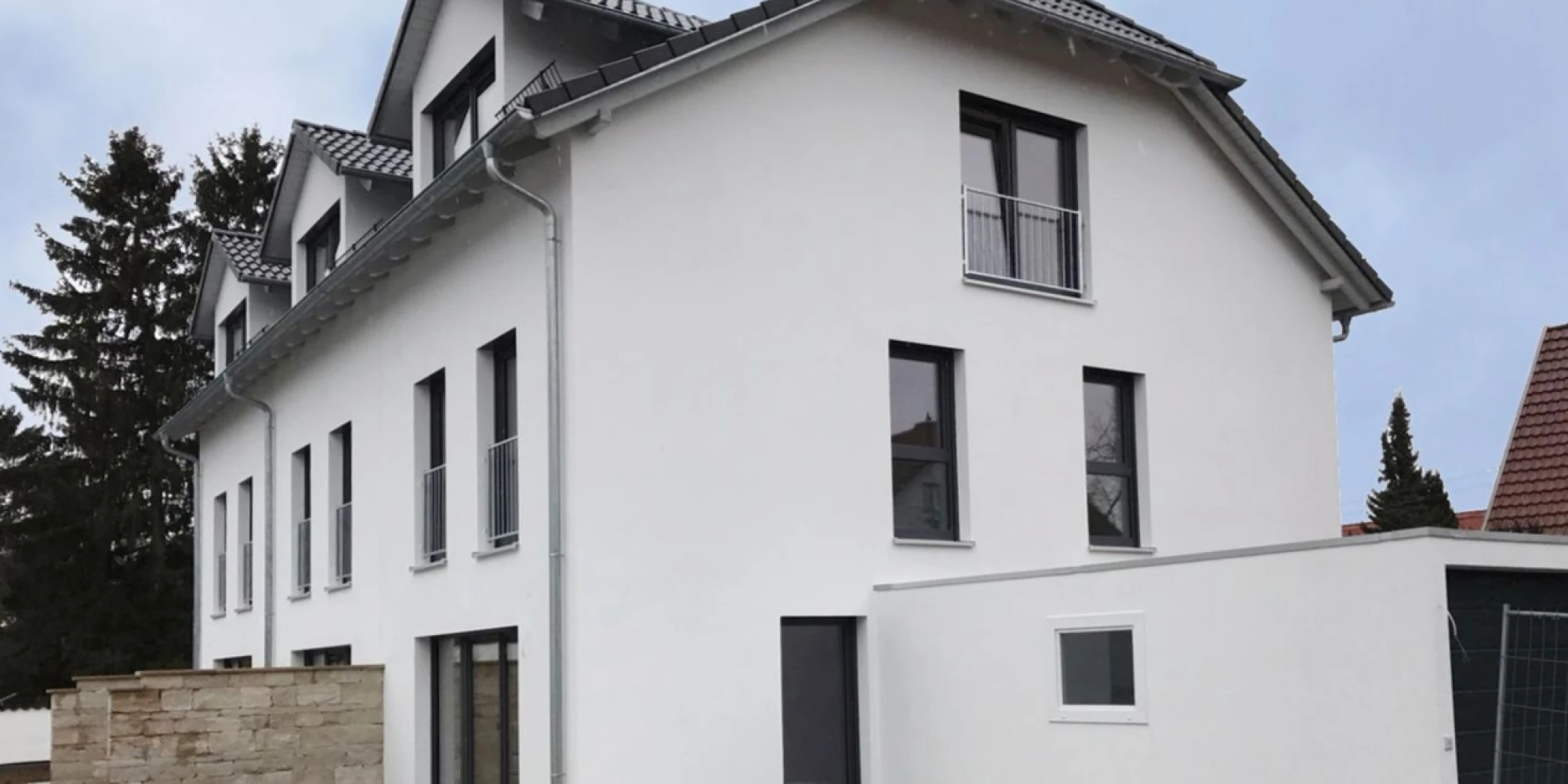 Mehrfamilienhaus bauen: Moderner 3-Spänner in München