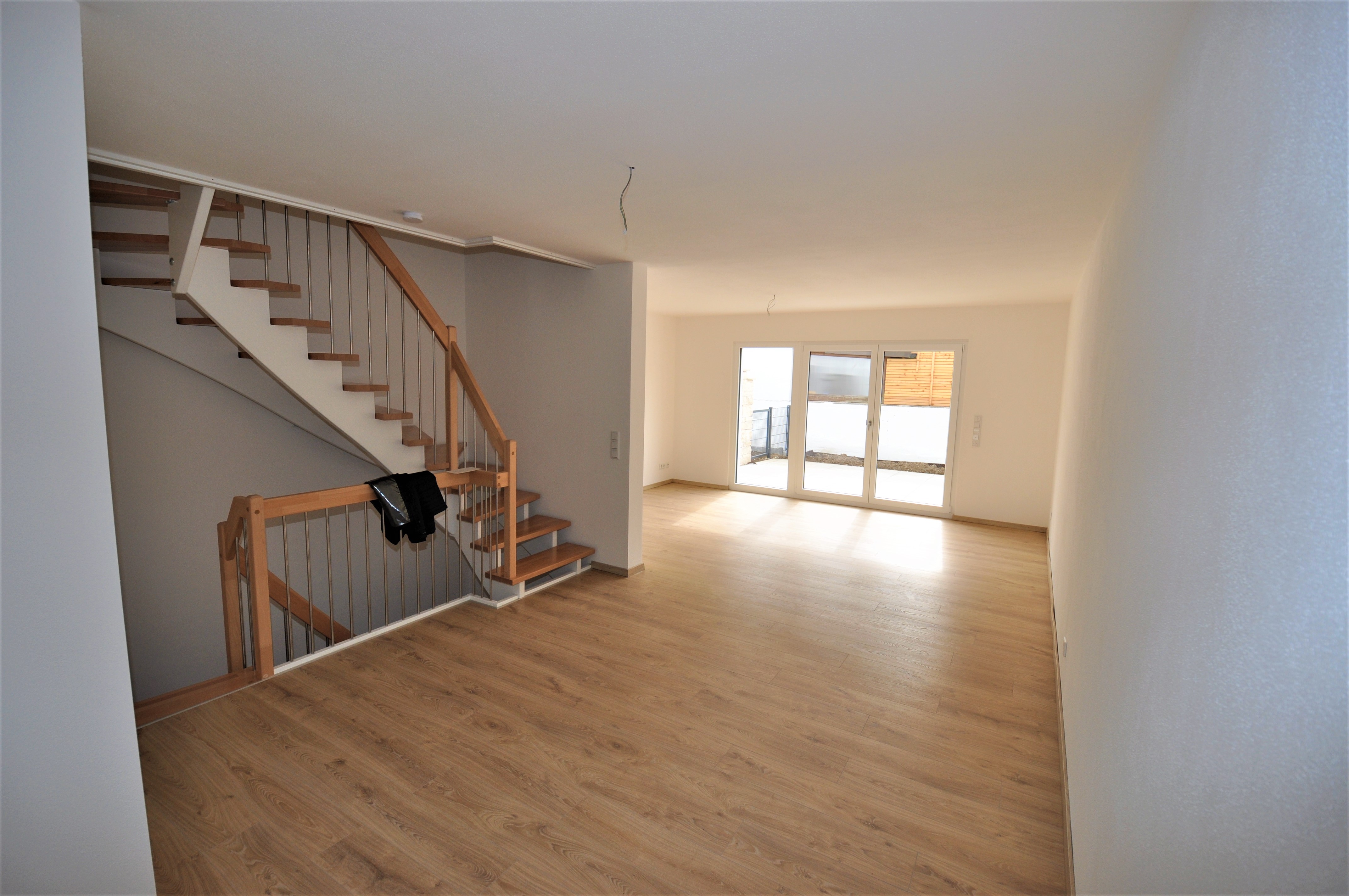 Mehrfamilienhaus bauen: Moderner 3-Spänner in München